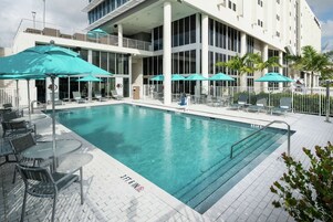 Outdoor pool, open 6:00 AM to 11:00 PM, pool umbrellas, pool loungers