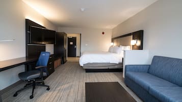 Hypo-allergenic bedding, desk, laptop workspace, blackout drapes