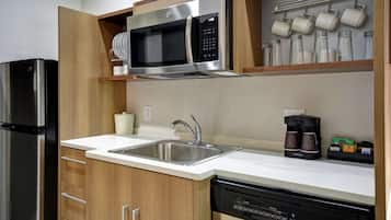 Full-size fridge, microwave, coffee/tea maker, cookware/dishes/utensils