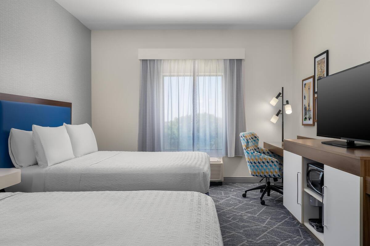 Room, 2 Queen Beds, Refrigerator | In-room safe, desk, laptop workspace, blackout curtains