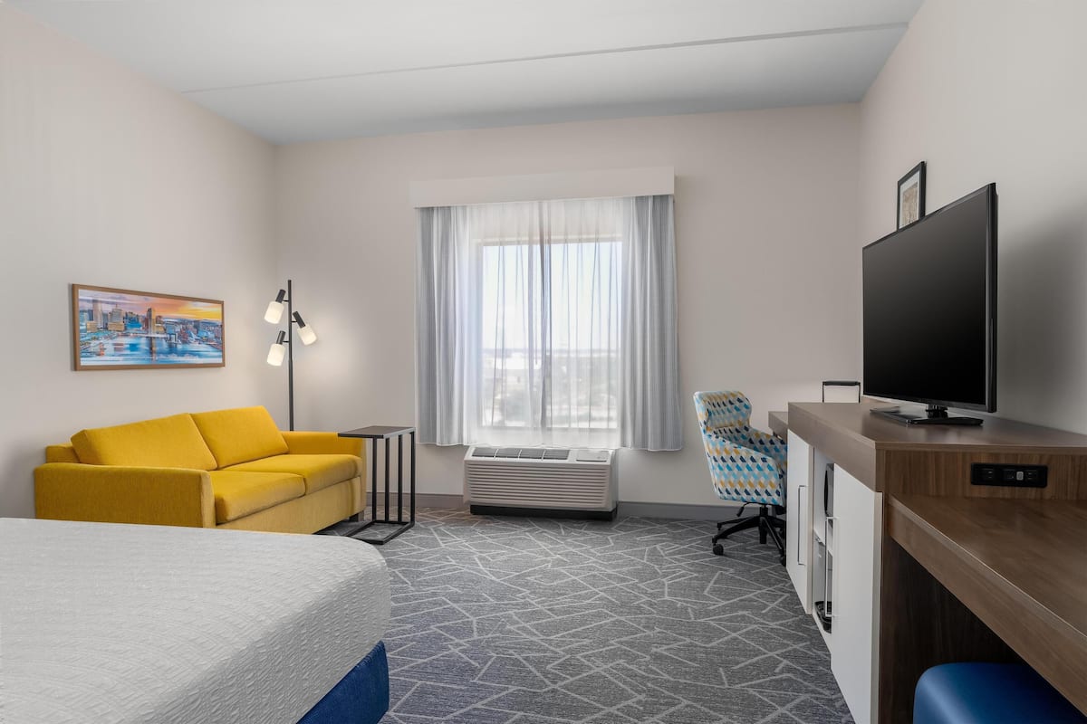 Room, 1 King Bed with Sofa bed, Refrigerator | Living area