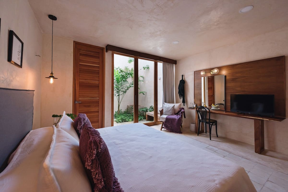 deluxe room, 1 double bed, pool view, garden area | hypo-allergenic bedding, in-room safe, individually decorated