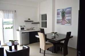 Premium Suite, 2 Double Beds, Refrigerator & Microwave, River View | Laptop workspace, iron/ironing board, free WiFi