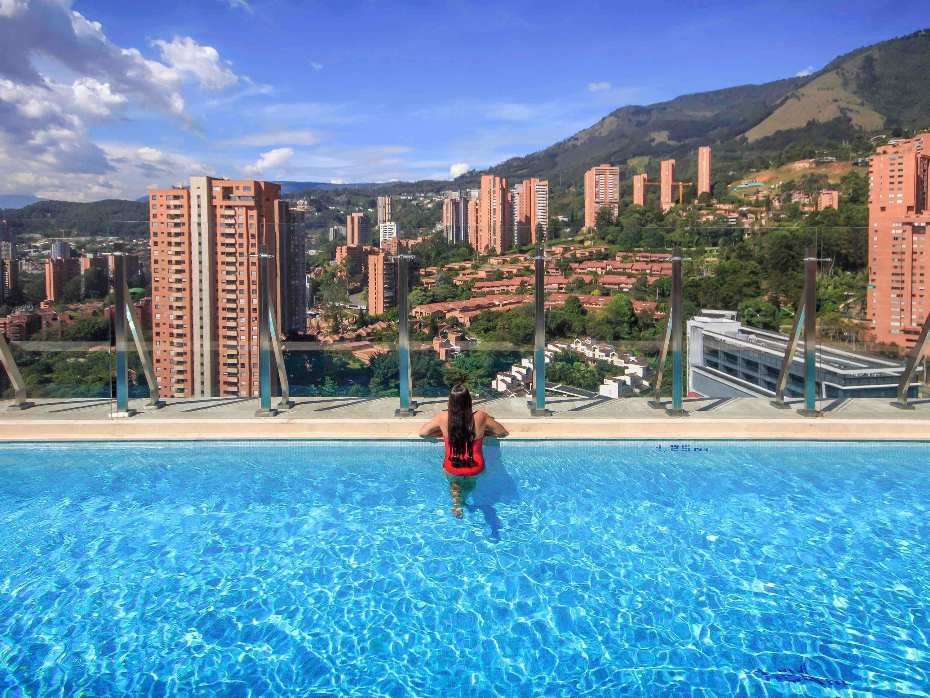 Outdoor pool, open 6 AM to 8 PM, pool loungers, lifeguards on site