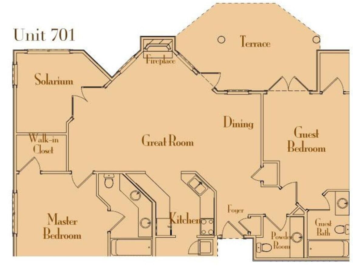 A floor plan of Unit 701 with a terrace, fireplace, dining area, guest bedroom, master bedroom, kitchen, powder room, and walk-in closet.