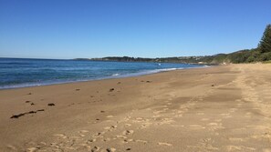 On the beach, sun-loungers