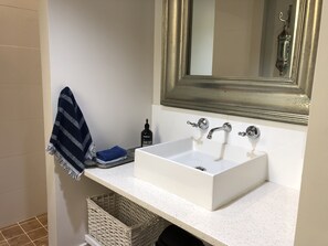 Shower, hair dryer, towels, toilet paper
