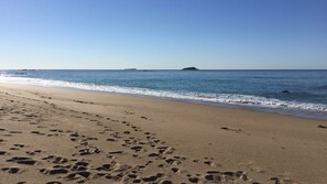 On the beach, sun-loungers