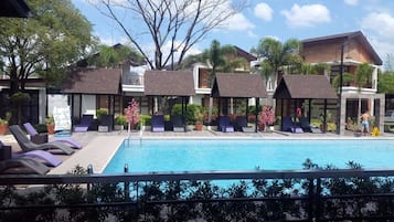 Outdoor pool, a natural pool, free pool cabanas, pool umbrellas