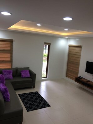 Villa, 2 Bedrooms | Living room | 43-inch flat-screen TV with cable channels, TV - The Tavern Hotel (Bacolor)