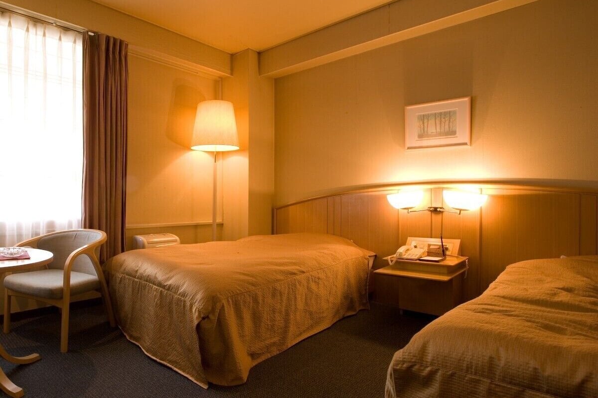Twin Room with Bath, Non Smoking | Minibar, in-room safe, desk, free WiFi