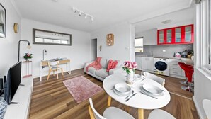 A modern apartment with a dining area, kitchen, and living space. - Bright & Sunny Oasis (Balaclava)