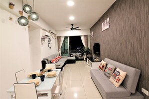 Apartment, 3 Bedrooms | Living room | Flat-screen TV