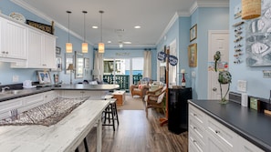 Enjoy meals in this well-appointed kitchen with a central island, ample counter space, and comfortable seating.