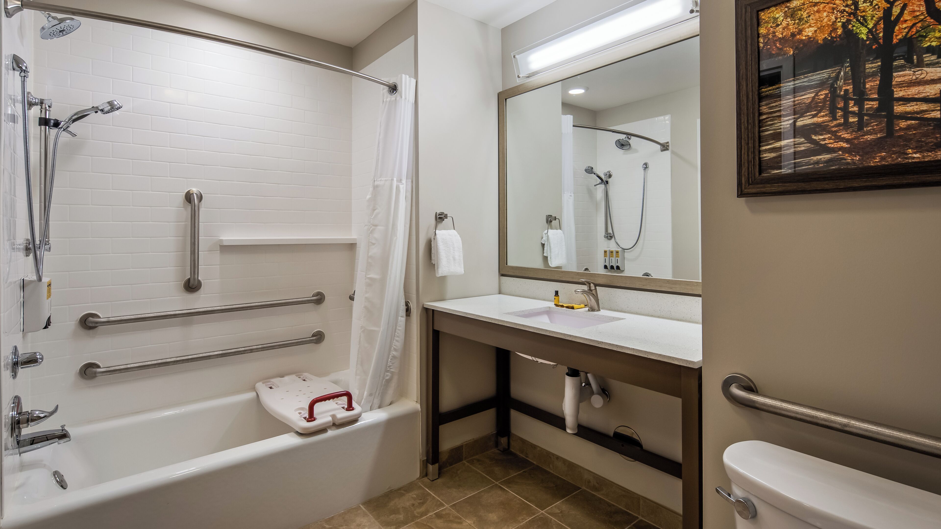 A bathroom with a bathtub, a sink, a toilet, and a shower.