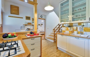 Fridge, stovetop, dishwasher, coffee/tea maker