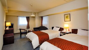 A hotel room with two beds, a desk, a chair, and a television. - Hotel Matsuo (Hamada)