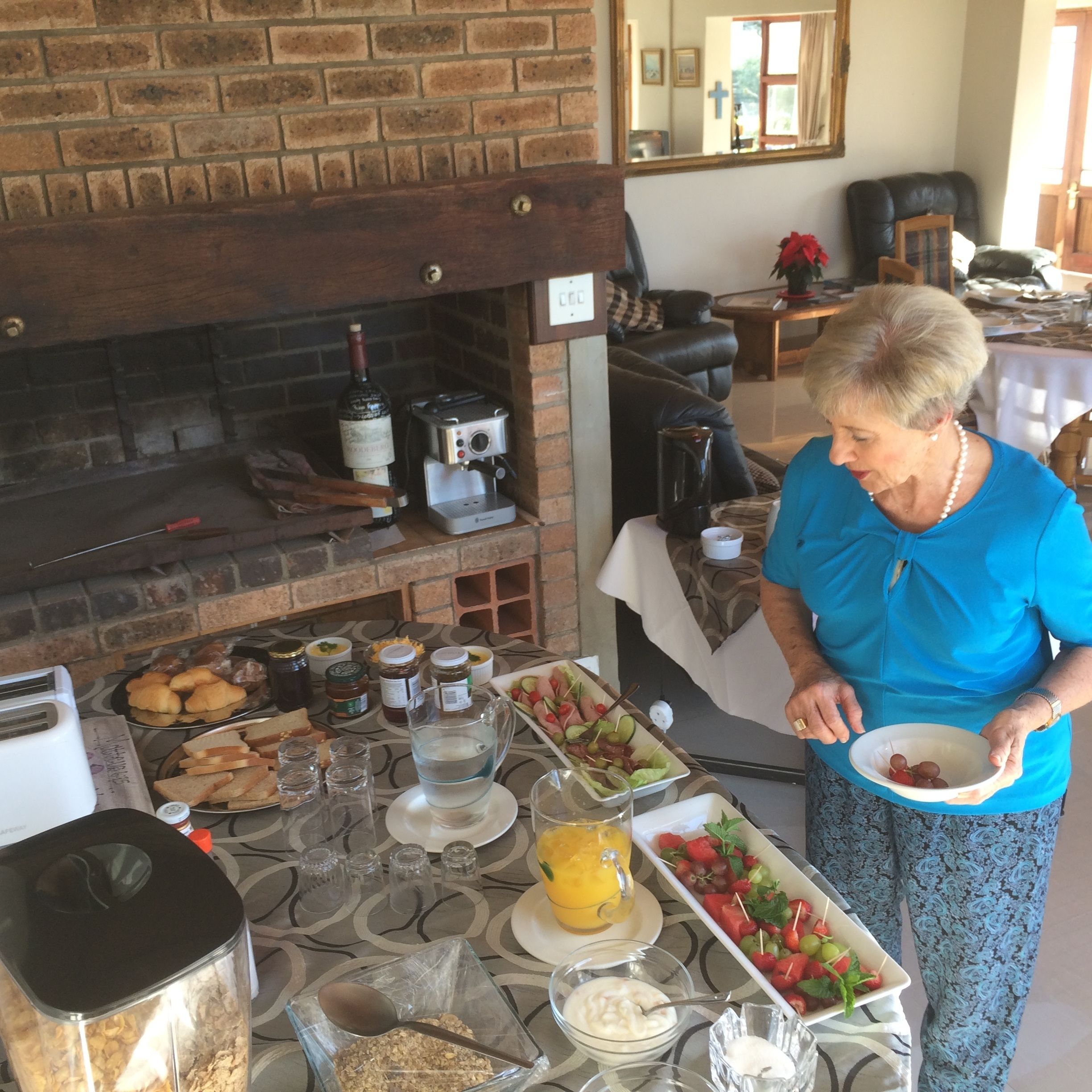 A breakfast buffet with various food items and a coffee machine.