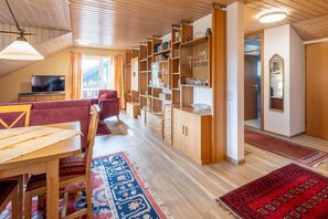 Flat-screen TV, DVD player, books, video library