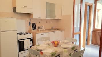 Classic Apartment, 3 Bedrooms | Private kitchen | Full-size fridge, oven, stovetop, coffee/tea maker