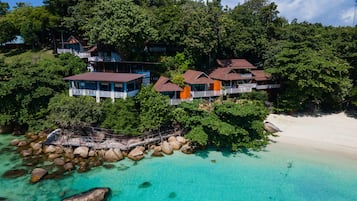 On the beach, white sand, sun loungers, beach towels