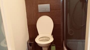 City Apartment, Kitchen, Courtyard Area | Bathroom | Shower, free toiletries, hair dryer, towels