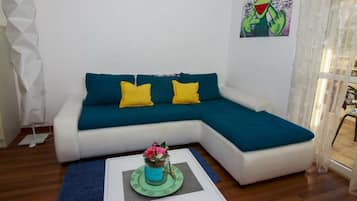 Apartment, 1 Bedroom, Garden View | Living area | Flat-screen TV
