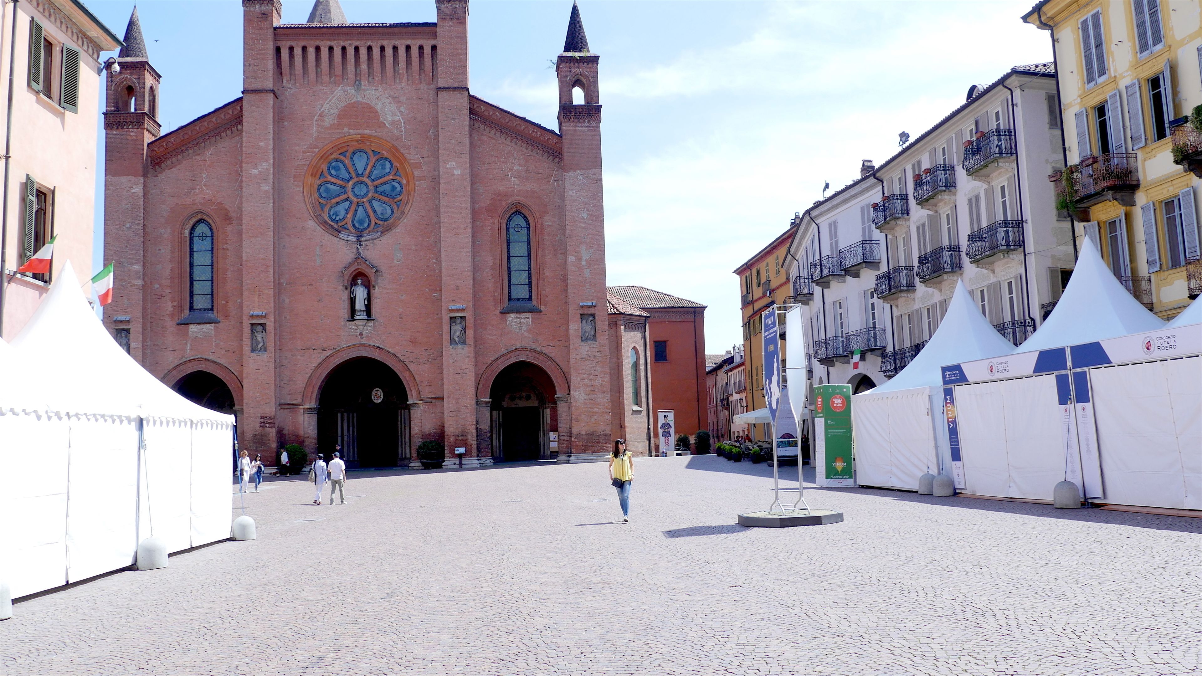 A historic church with a prominent rose window and twin towers.