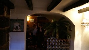 An interior with a wooden ceiling, a sign reading "BULLDOG", and a large plant. - The Crown Inn (Alfreton)