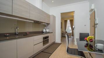 Apartment, Private Bathroom (F1-40) | Private kitchen | Fridge, microwave, oven, stovetop