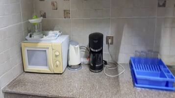 Apartment | Private kitchen | Full-size fridge, microwave, oven, stovetop