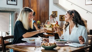 A dining table with plates, glasses, and a bowl of bread. - Casa del Vino della Vallagarina (Isera)