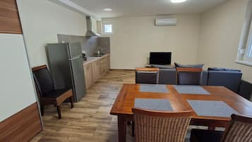 Superior Apartment, 1 Bedroom | Living area | 80-cm flat-screen TV with cable channels, TV