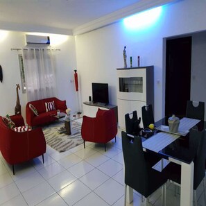 Comfort Studio Suite, 1 Bedroom | Living area | LCD TV - Residence Cécilia (Abidjan)