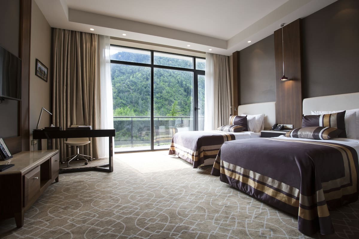 deluxe twin room, 1 bedroom, mountain view | 1 bedroom, minibar, in-room safe, desk