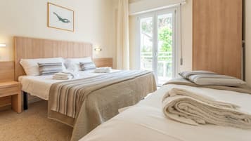 Triple Room, Balcony | In-room safe, desk, free WiFi, bed sheets