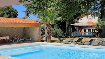 Outdoor pool, a heated pool, sun loungers