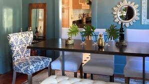 A dining area with a chandelier, a mirror, and a bench. - UPTOWN OASIS W PRIVATE, HEATED POOL, Minutes to all New Orleans' top attractions (New Orleans)