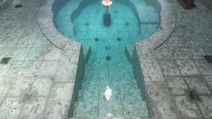 A circular pool with a central fountain, surrounded by a tiled floor. - Gyokusenkaku (Nagato)
