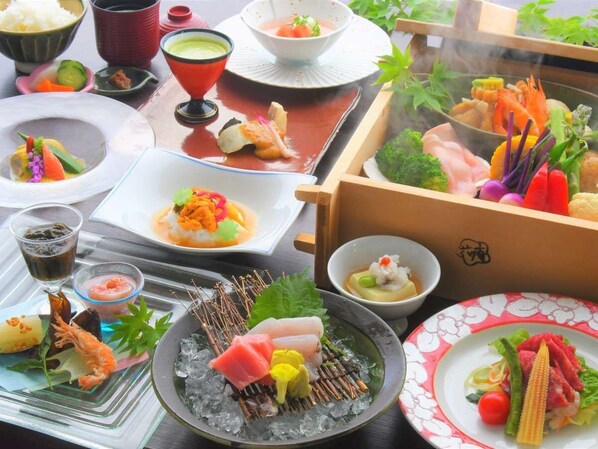 A variety of dishes on a table, including sushi, sashimi, and other seafood items, suggesting a Japanese dining experience. - Nikko Chuzenji-ko Onsen Hotel Hana-An (Nikko)