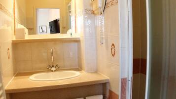 Shower, free toiletries, hair dryer, towels