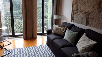 Apartment, 1 Bedroom, Balcony (2F) | Living area | 20-inch flat-screen TV with cable channels, TV
