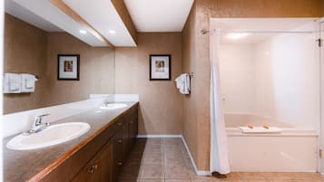 Deluxe Suite, 1 Bedroom, Balcony | Bathroom | Combined shower/tub, free toiletries, hair dryer, towels