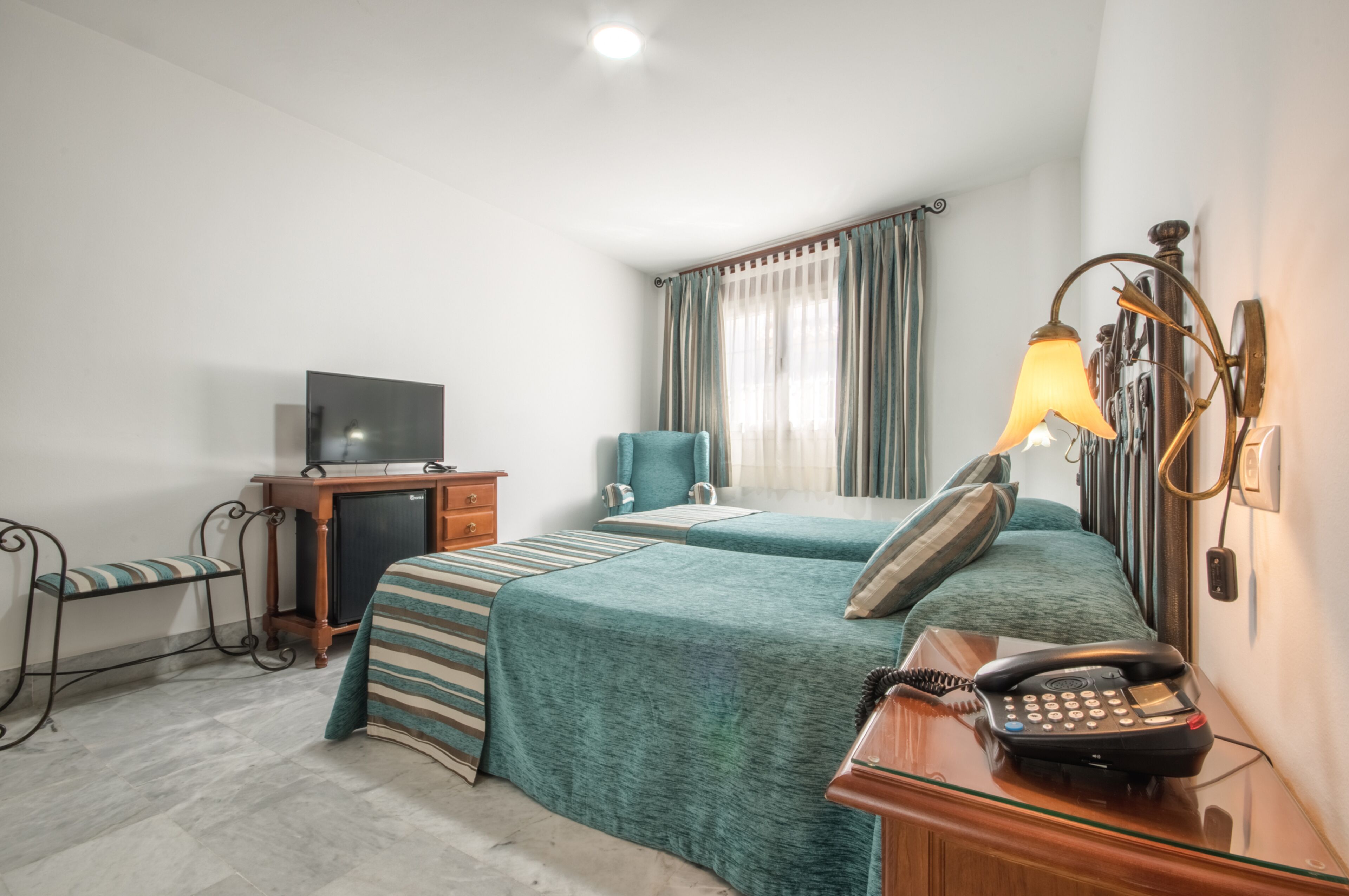 twin room | minibar, in-room safe, desk, laptop workspace