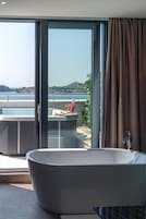 Executive Suite, 1 Bedroom, Sea View | Bathroom | Shower, free toiletries, hair dryer, slippers