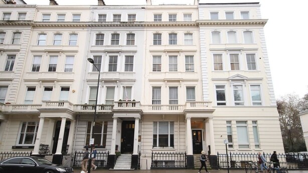 A multi-story building with a classic architectural style, featuring symmetrical windows and a central entrance with steps. - Belgravia Apartments - Gloucester Road (London)
