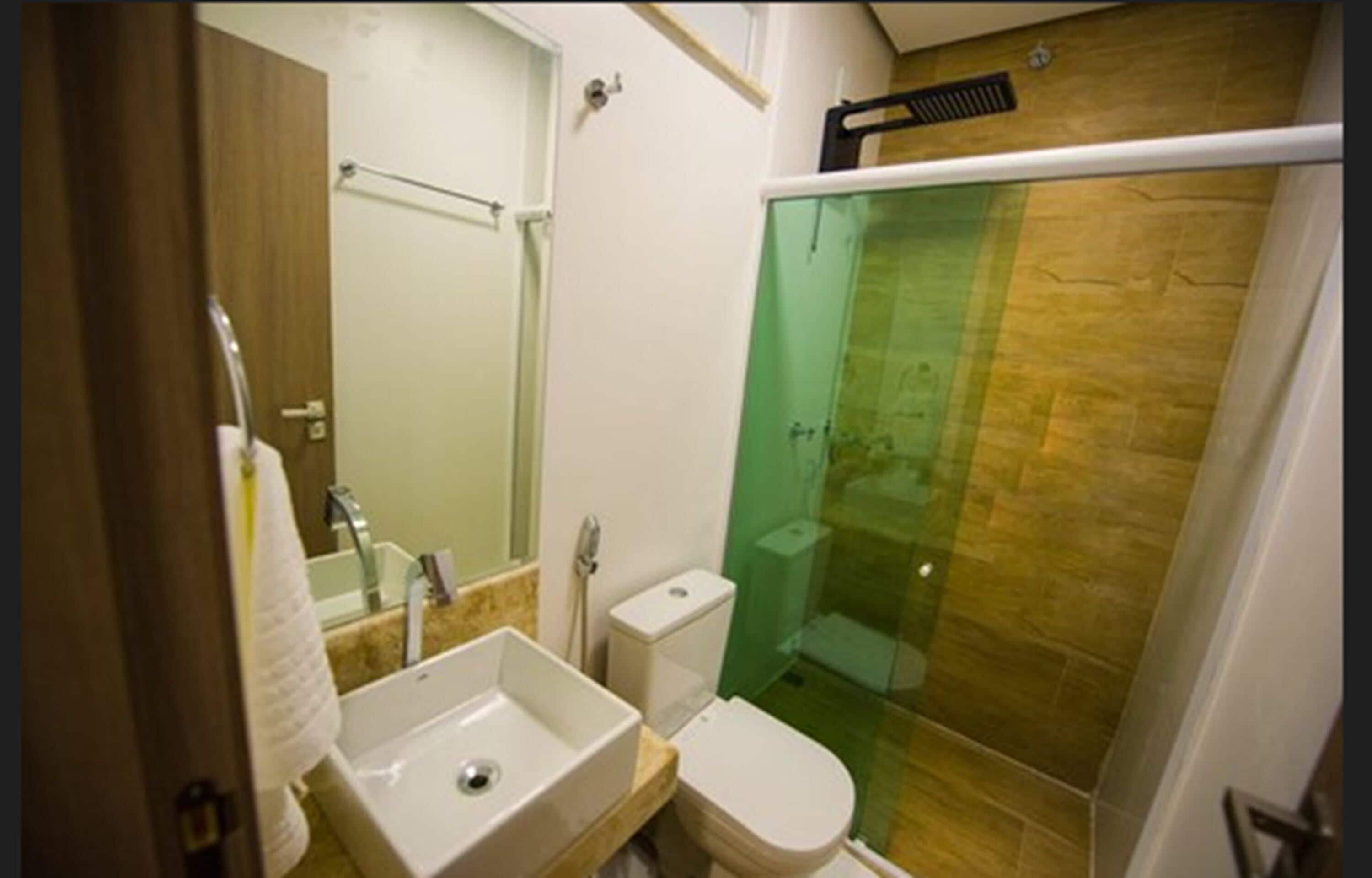 deluxe quadruple room | bathroom | shower, hair dryer, towels