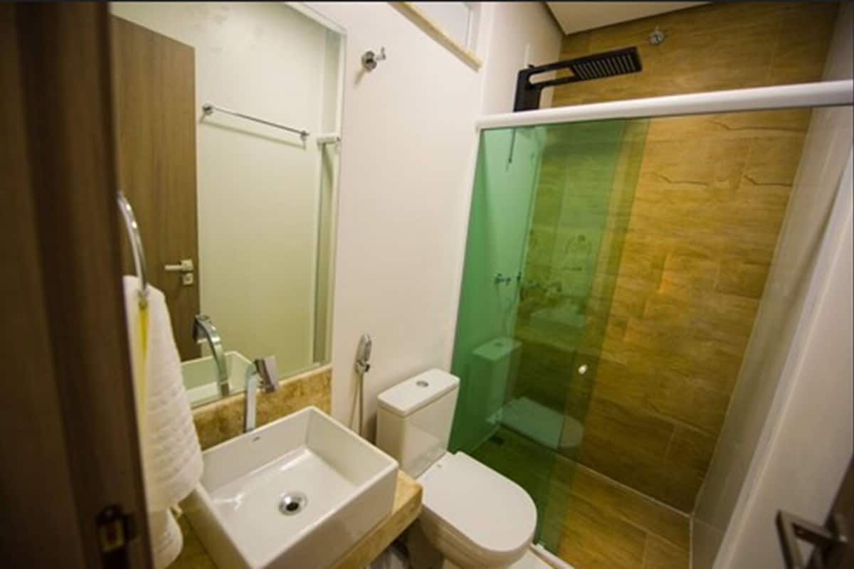 deluxe quadruple room | bathroom | shower, hair dryer, towels