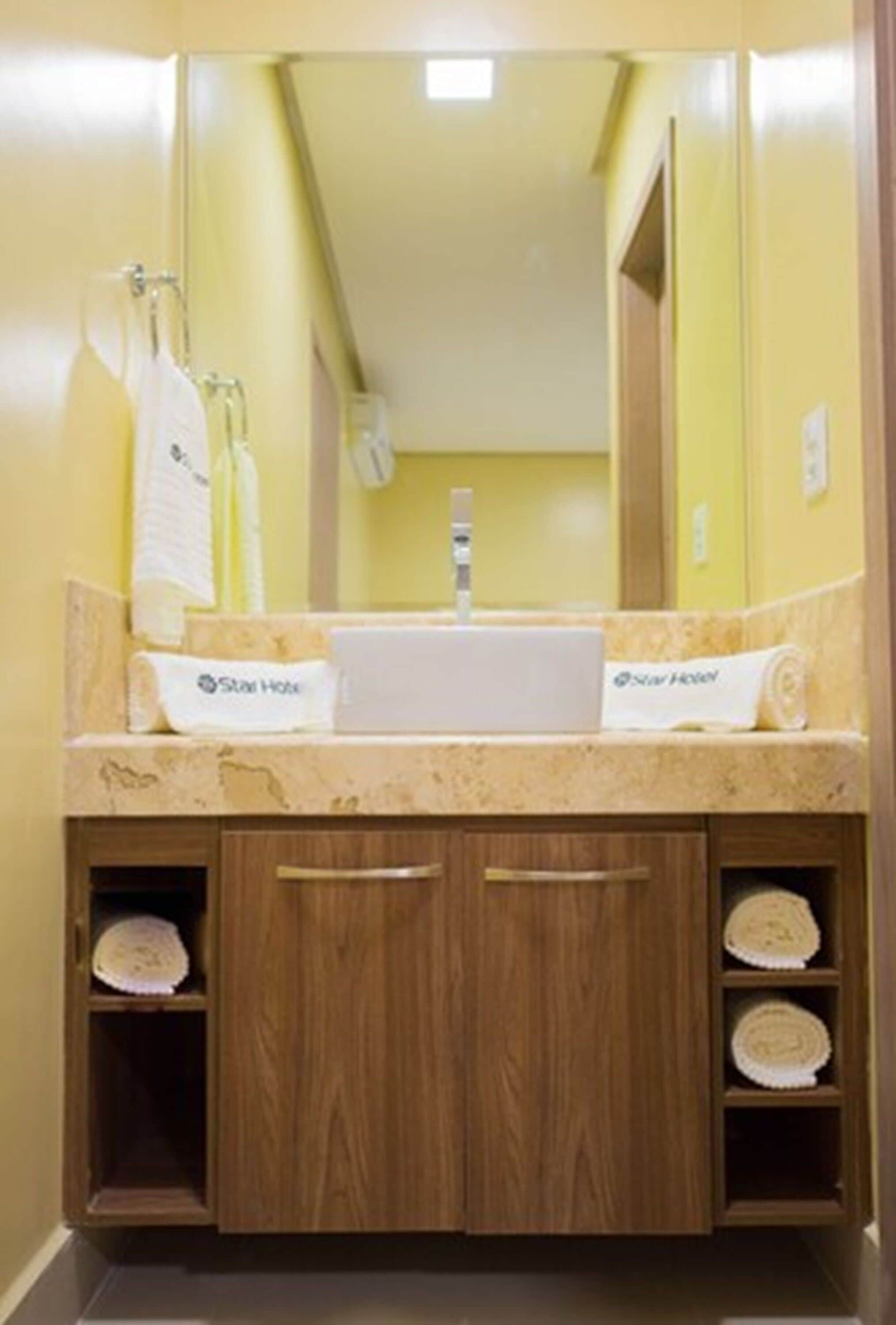 deluxe triple room | bathroom | shower, hair dryer, towels