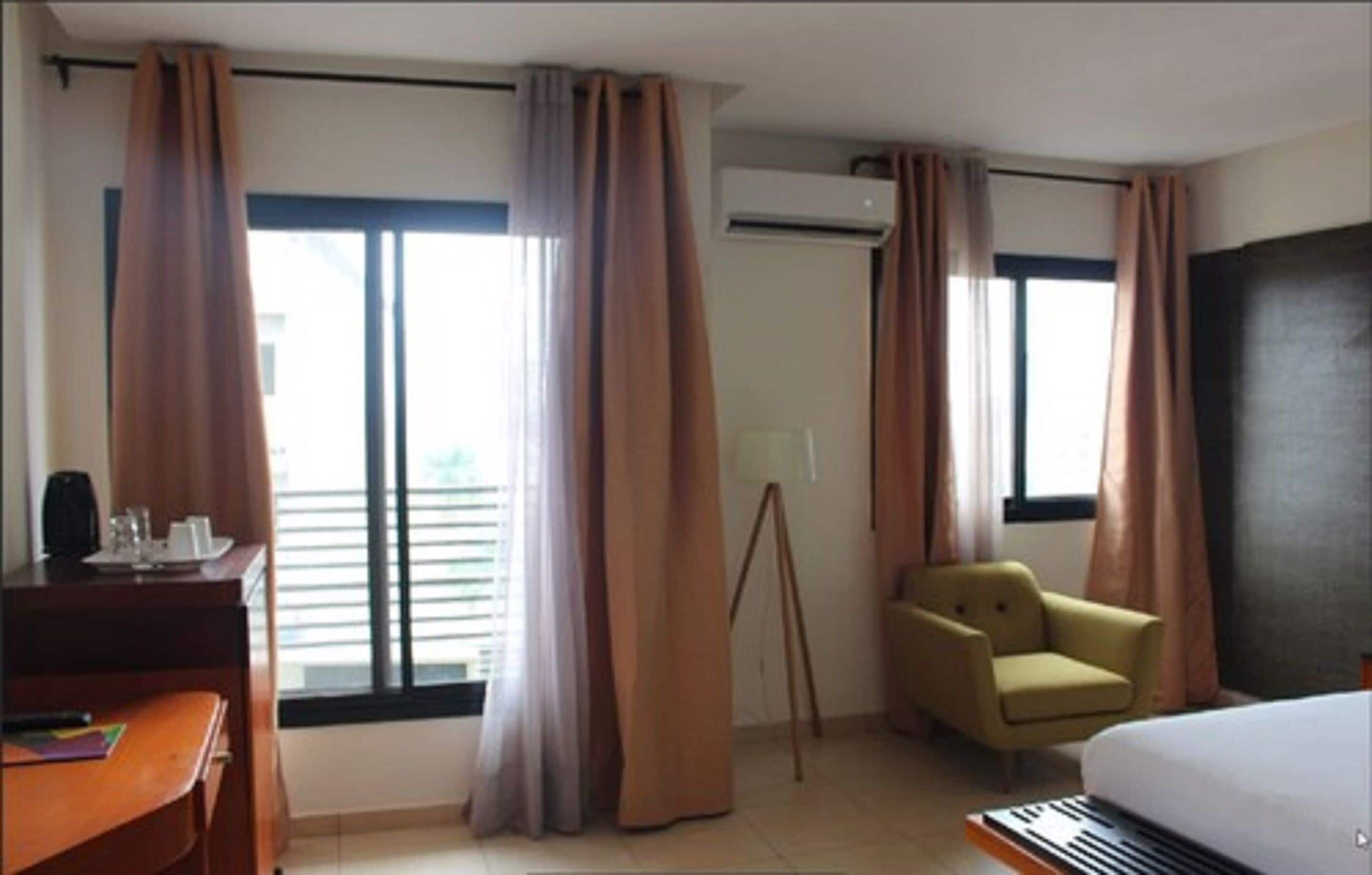 deluxe double room | living area | 32-inch flat-screen tv with satellite channels, tv